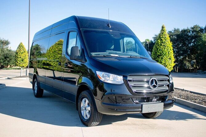 Arrival Private Transfer from MAD Airport to Madrid in a Minibus - Meet-your-driver setup: sign, arrival lounge, and flight monitoring