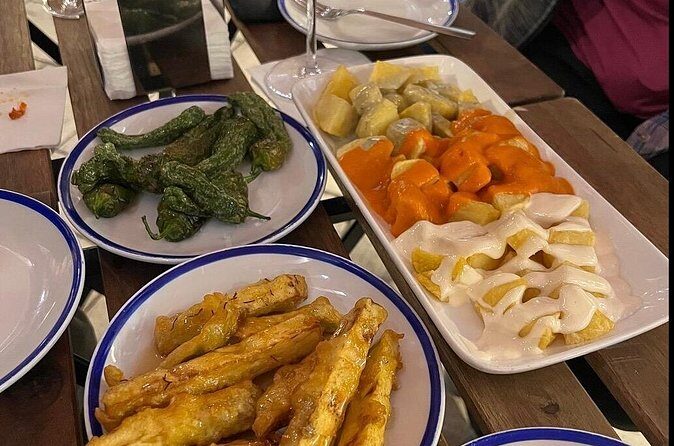 Experience Private Tapas and Wine Tour in Madrid - The wine bar that doubles as a shop: ham, sausages, and quince toast