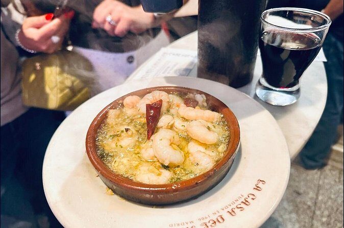 Experience Private Tapas and Wine Tour in Madrid - Puerta del Sol finish: the Bear and Strawberry Tree