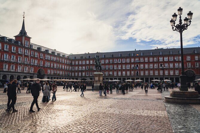 Imperial Madrid Private Journey through the Austrias - Puerta del Sol: Madrid’s center-point start