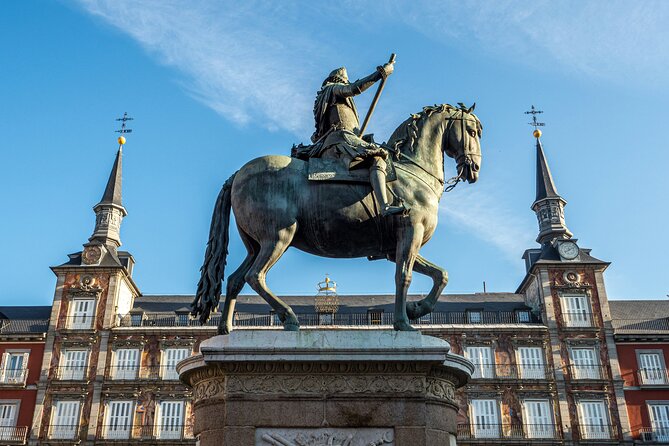 Madrid Bike Tour with Churros and Wine, Ham, and Cheese Upgrade - Puerta de Alcalá and the old city walls story