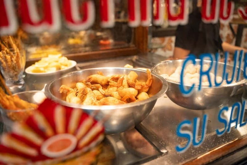 Madrid: Evening Tapas Tour with 5 Delicious Stops & Drinks - Puerta del Sol finish: shrimp, Spanish wine, and dessert
