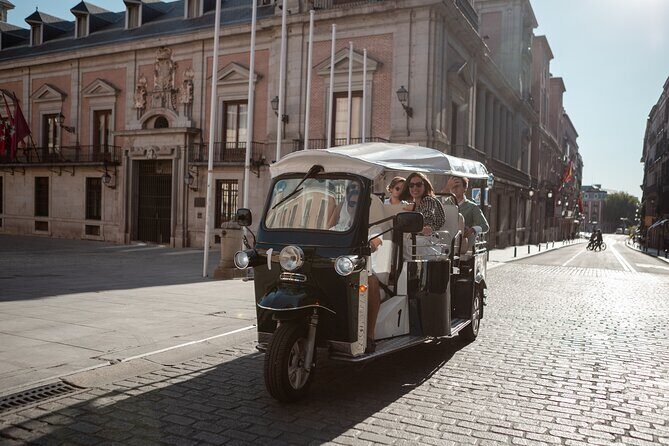 Madrid Express Tour with Local Guide in Eco Tuk Tuk Private - Meeting at Plaza de Oriente: finding Puerta del Príncipe without stress