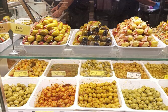 Madrid Food Tour: Tapas, Drinks and Delights with a Local - Plaza de Jacinto Benavente: Tortilla de patatas, the share-everywhere classic