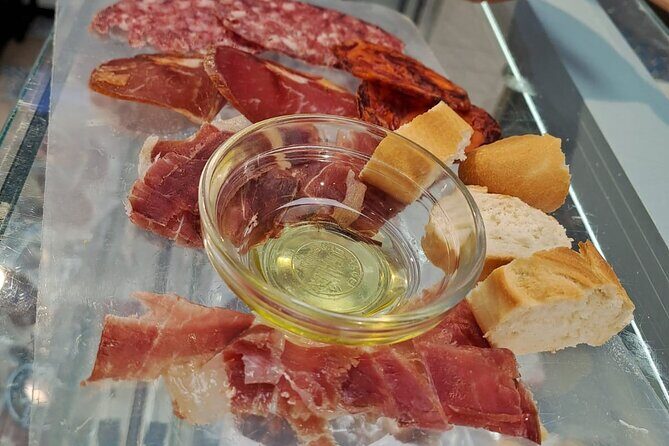 Madrid Food Tour: Tapas, Drinks and Delights with a Local - Plaza Mayor street-food energy: Bocadillo de calamares