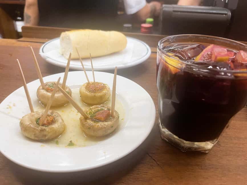 Madrid: Guided Local Food Tour at Hidden Gem Restaurants - The Tortilla Madrileña finish (in a historic setting)
