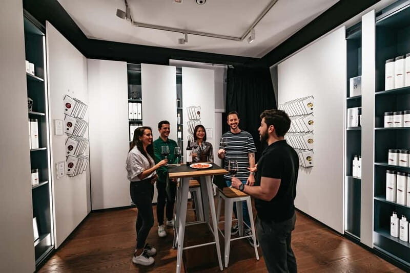 Madrid: Guided Tapas and Wine Tour with Terrace Visit - The visitor center and market time: seeing Madrid food culture up close