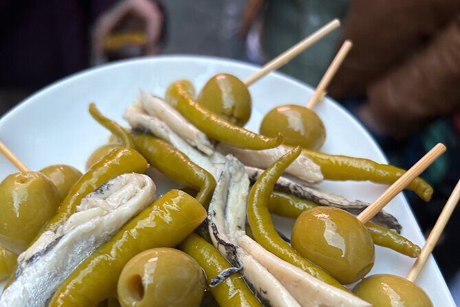 Madrid Local Tapas Tour with Private Dinner and Bottomless Wine - Key highlights to know before you go
