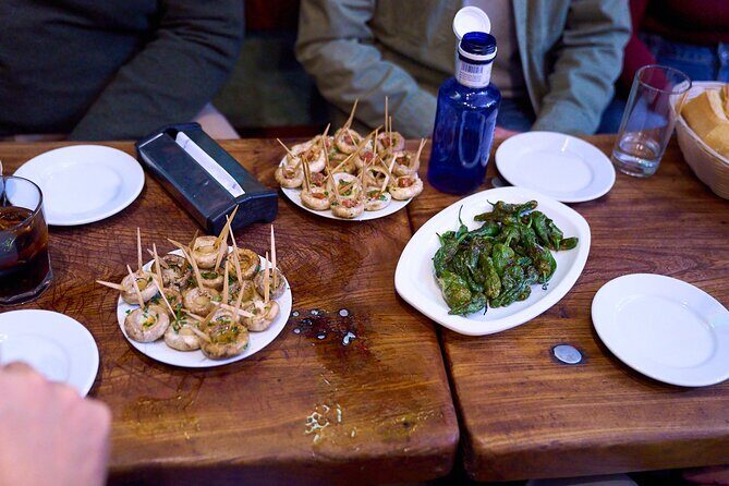 Madrid: Not Just Another Tapas & Wine Tour by Eating Europe - Ciriaco at Calle Mayor 84: the ham-and-toasts, cellar-style start