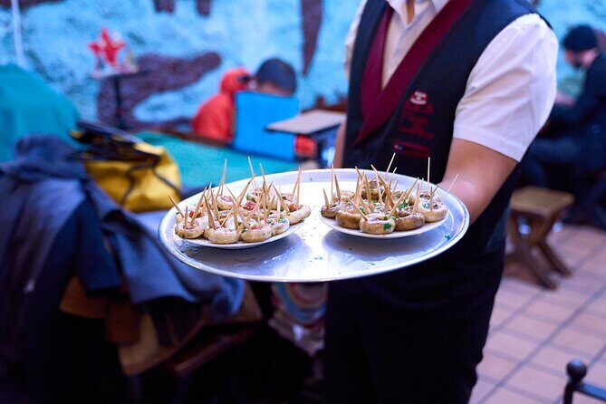 Madrid: Not Just Another Tapas & Wine Tour by Eating Europe - La Campana and La Trucha: calamari, rice twists, and old-school specialties