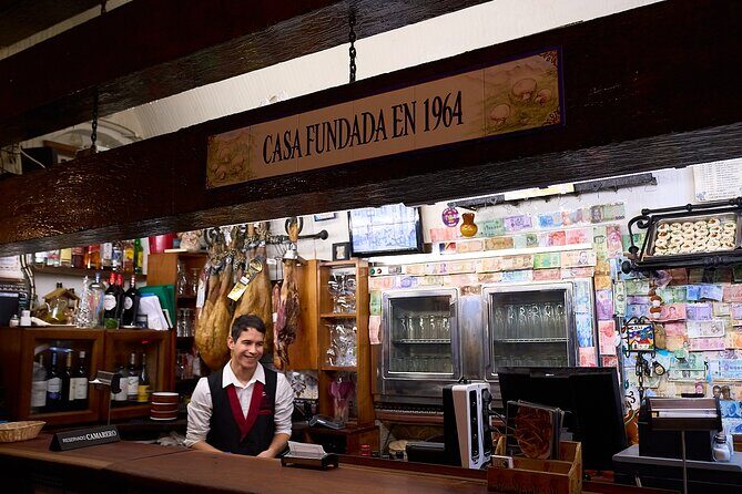 Madrid: Not Just Another Tapas & Wine Tour by Eating Europe - Mercado de San Miguel: the food market moment, then chocolate