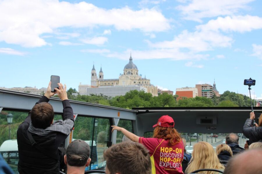 Madrid: Panoramic Open-Top Bus Day or Night Tour with Guide - Reina Sofía and Atocha: finishing with museums and transit energy