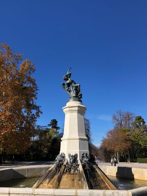 Madrid: Prado Avenue and Retiro Park Guided Walking Tour - Neptune Fountain and the Prado Museum photo moment