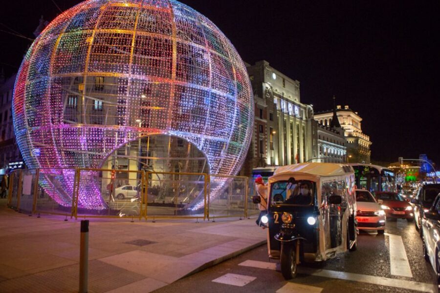Madrid: Private Christmas Lights Tour by Eco Tuk-Tuk - Neptune Fountain in Plaza de Cánovas: The Neoclassical Night Moment