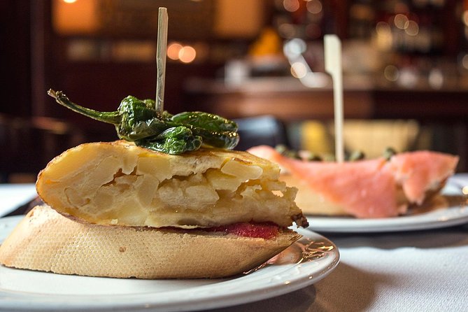 Private: Madrid Historic Centre Food Tour with 10+ Authentic - Stop 1: Pastry, a 180-year deli, then squid sandwich and vermouth