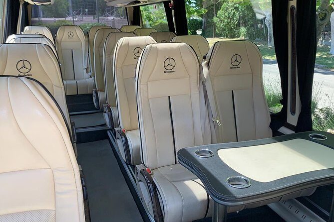 Private Transfer Madrid Barajas Airport to Madrid in Vans up to 7 Passengers - Bottled Water and Door-to-Door Convenience