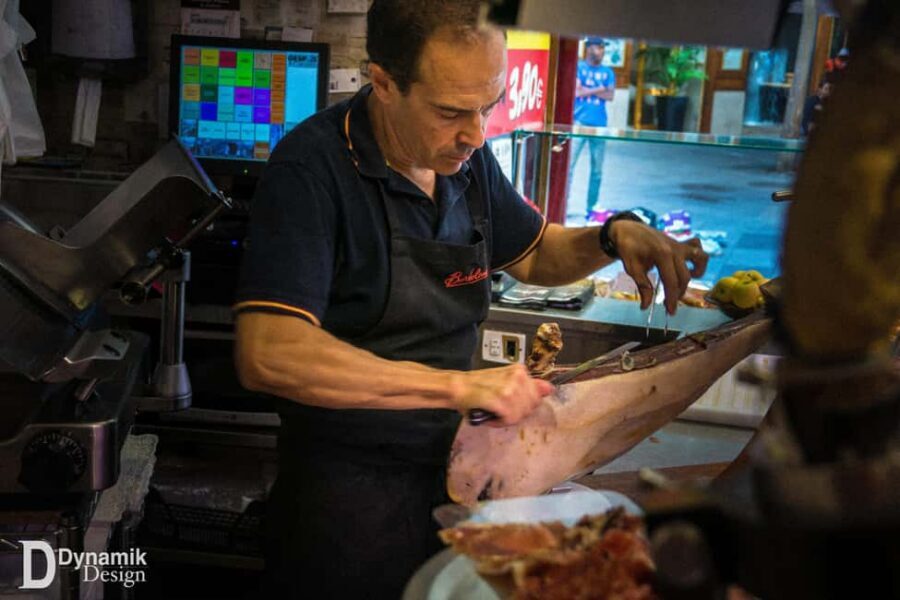 Secret Food Tours Madrid - Deep-fried squid sandwich, patatas bravas, and olives