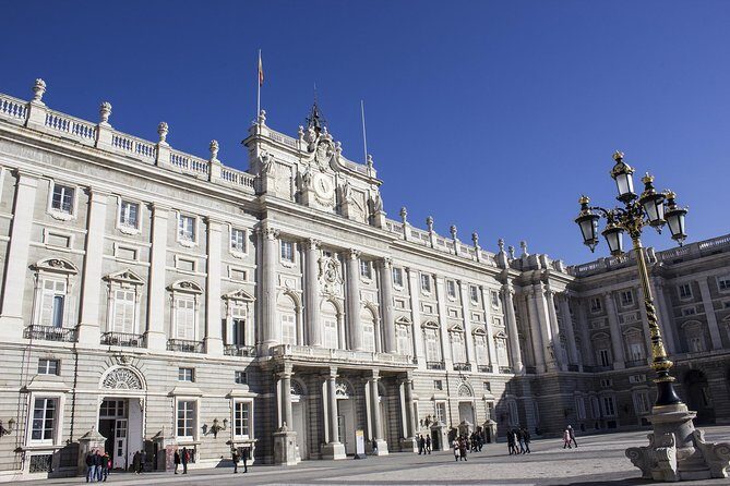 Skip-the-line Madrid Royal Palace with tapas tasting & Retiro Park - Plaza de Isabel II: the quick stage-set before the palace