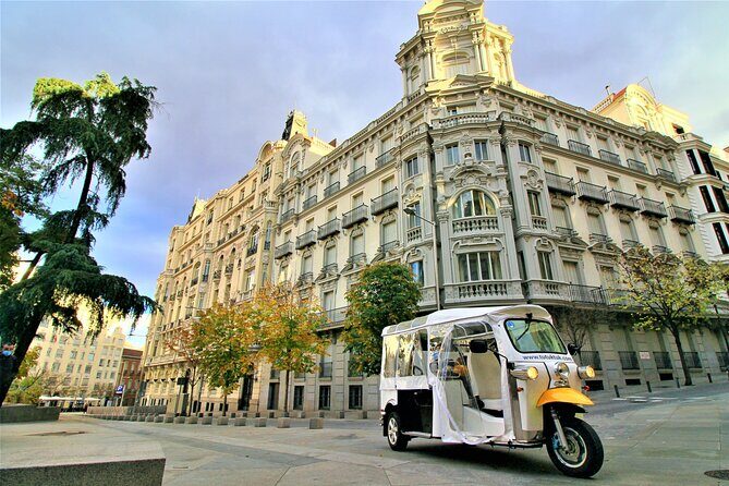 Tour of Historic and Modern Madrid with a guide in a yellow tuk tuk - Plaza de Isabel II start: your “now I get Madrid” moment